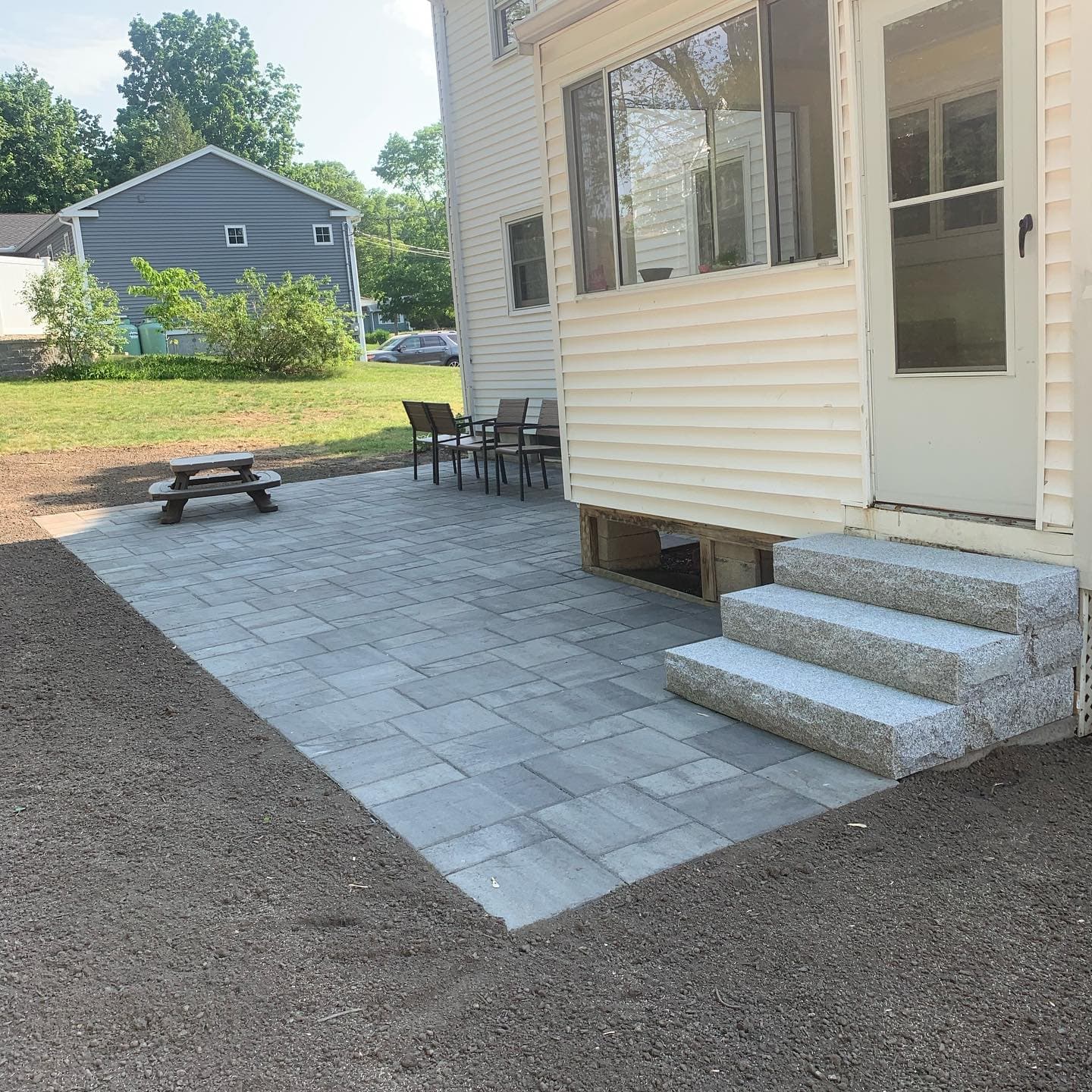 Paver patio with granite steps