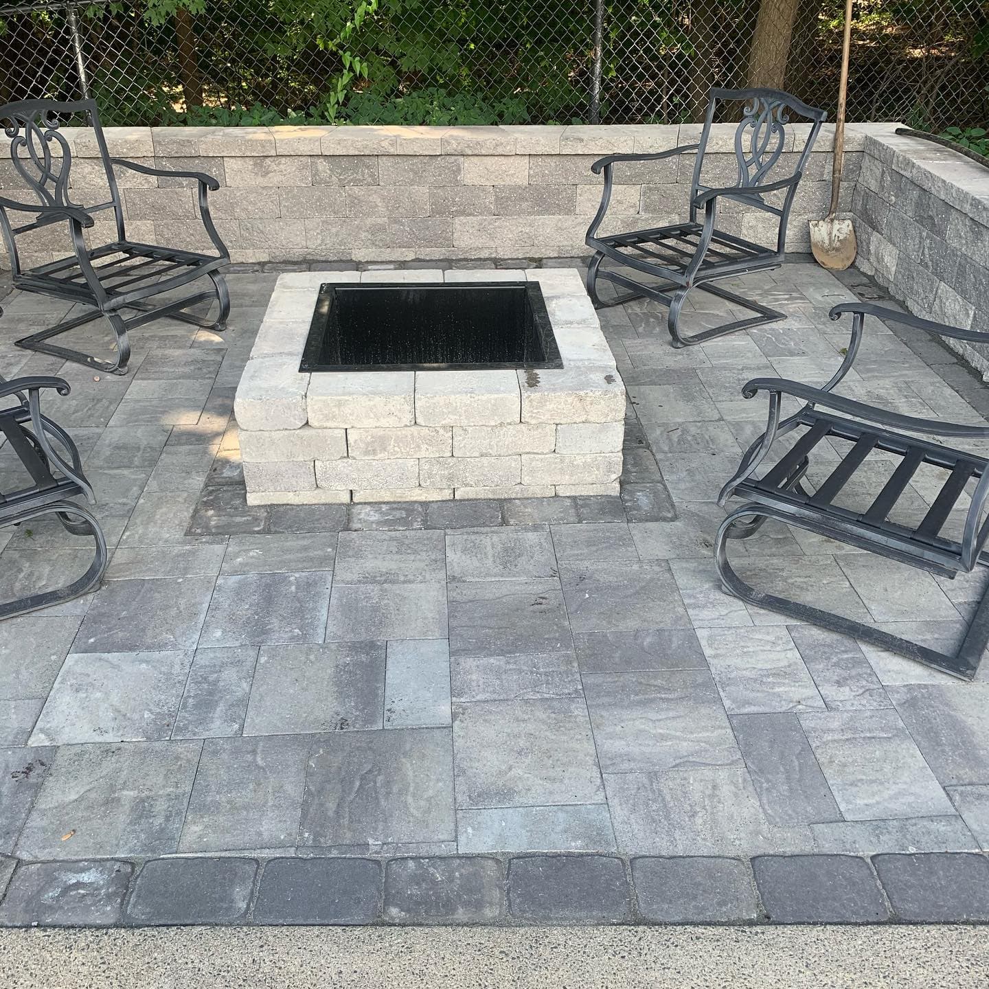 Paver patio with a square fire pit