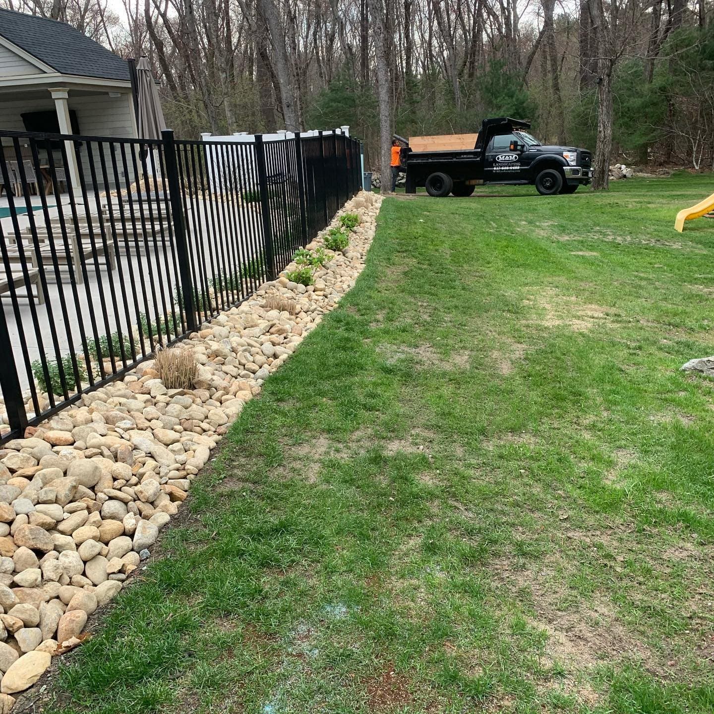 Lawn with a river rock border