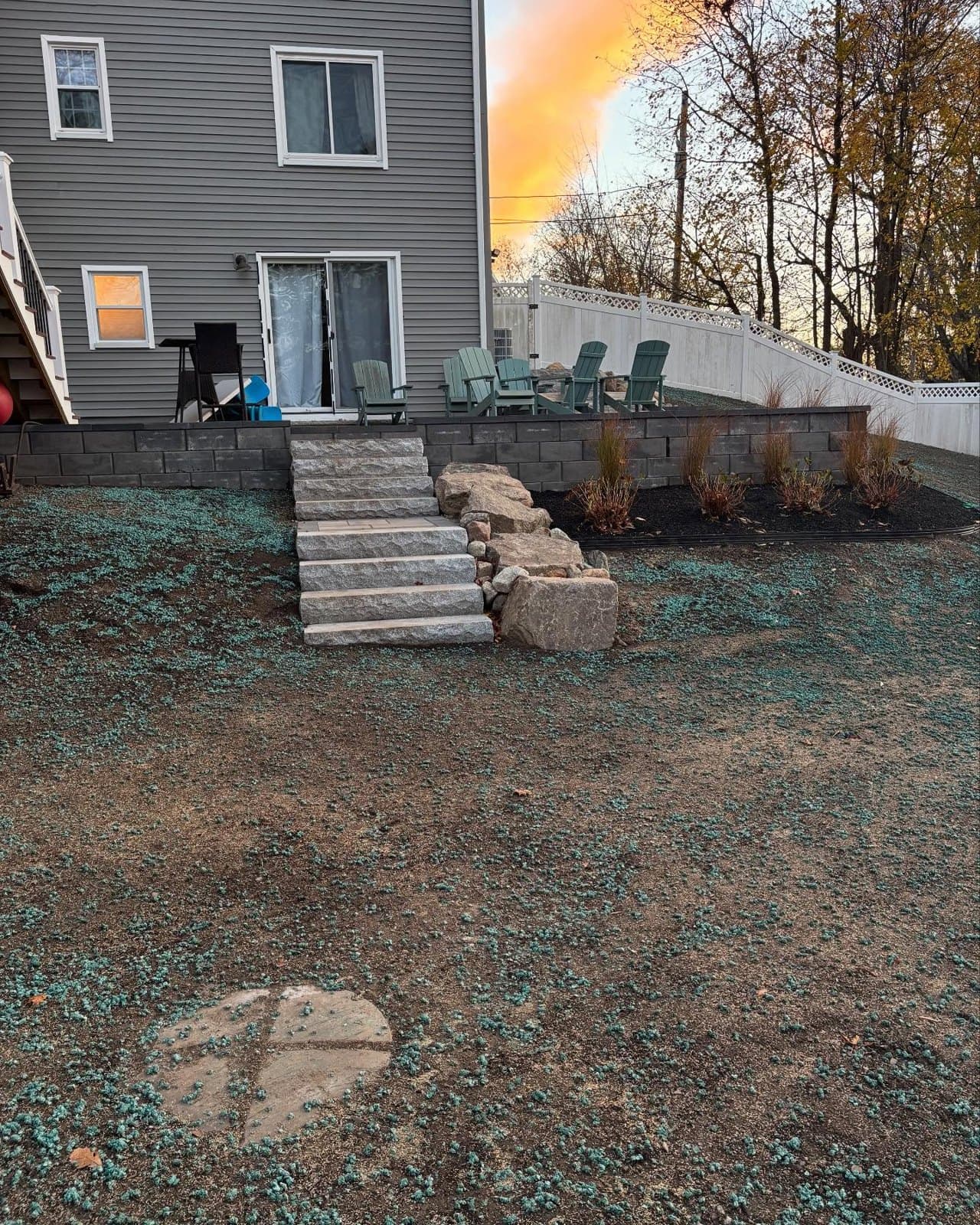 Granite steps and a boulder wall